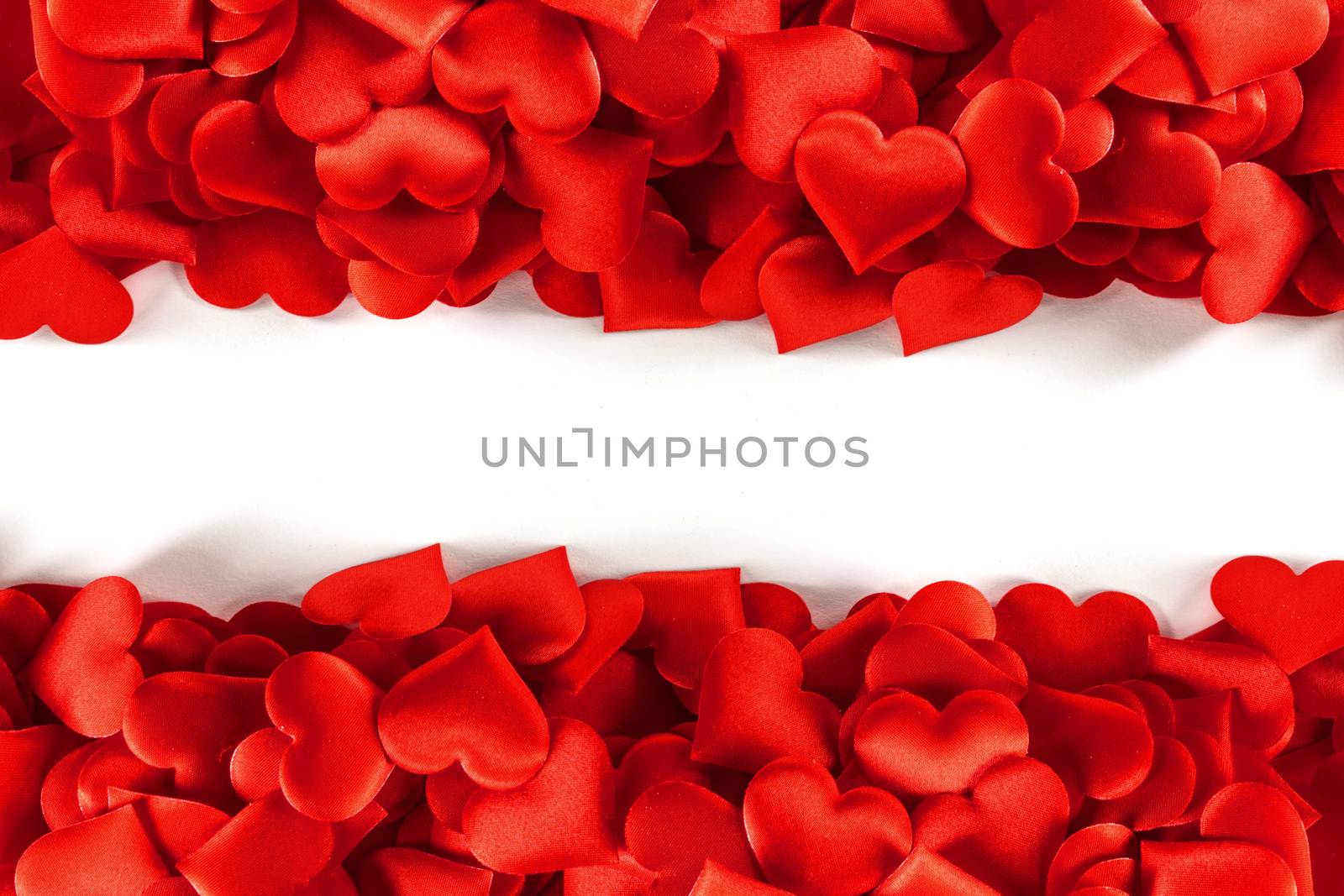 Valentine's day many red silk hearts background , border frame isolated on white with copy space, love concept