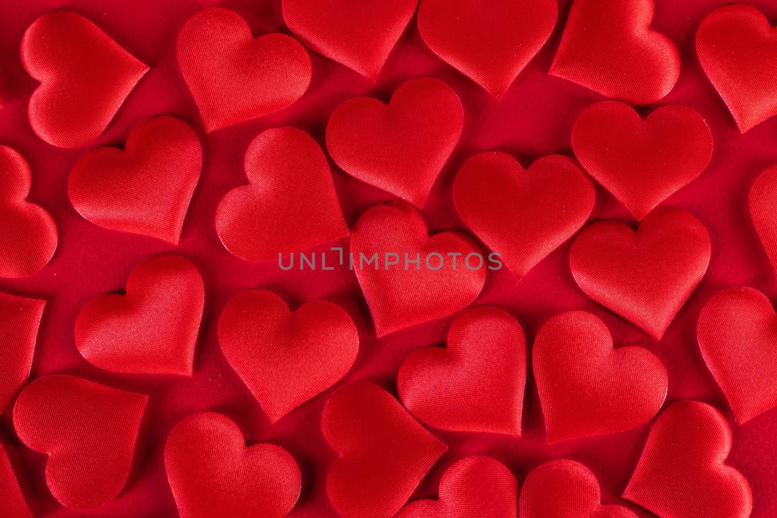 Valentine's day many red silk hearts background, love concept