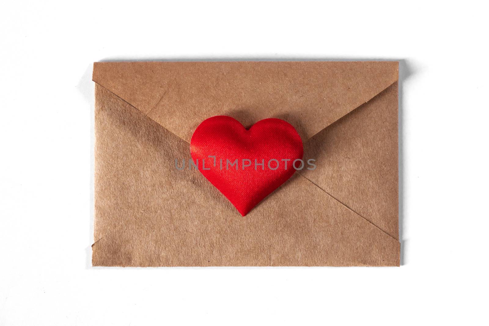 Valentine day love letter, envelope of craft paper with red heart isolated on white background