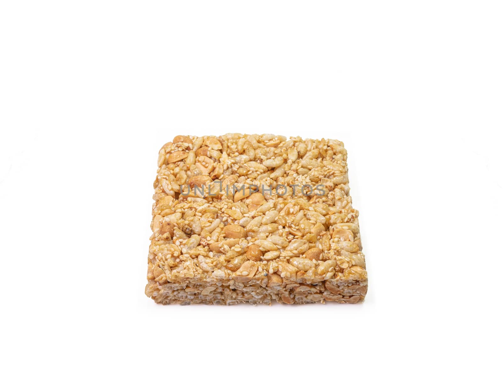 The close up of homemade Thai sweet cereal bar candy on white background, traditional muesli food in thailand.