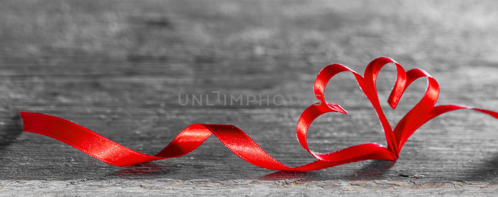 Two red ribbon hearts on wooden background with copy space for text, Valentines day concept