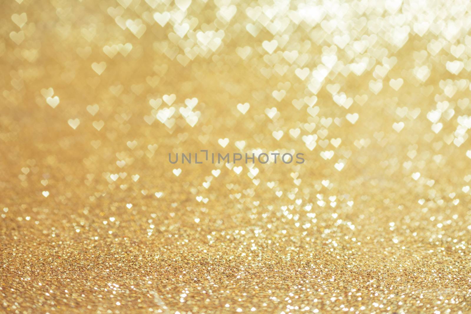 Golden glitter heart shape bokeh abstract background for Valentine day