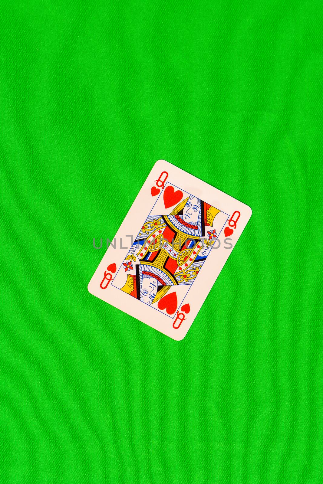 Playing card depicting the queen of hearts, poker card on colored background