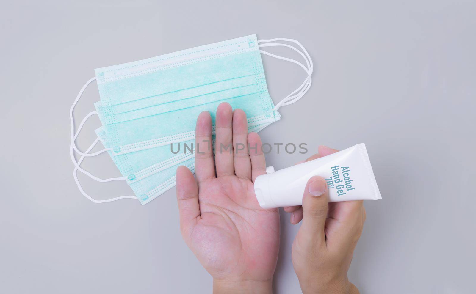 Hand of man using alcohol hand gel rub and clean hand for hygiene prevention covid-19 or coronavirus isolated on white background, protective outbreak covid 19, disinfectant or antibacterial.