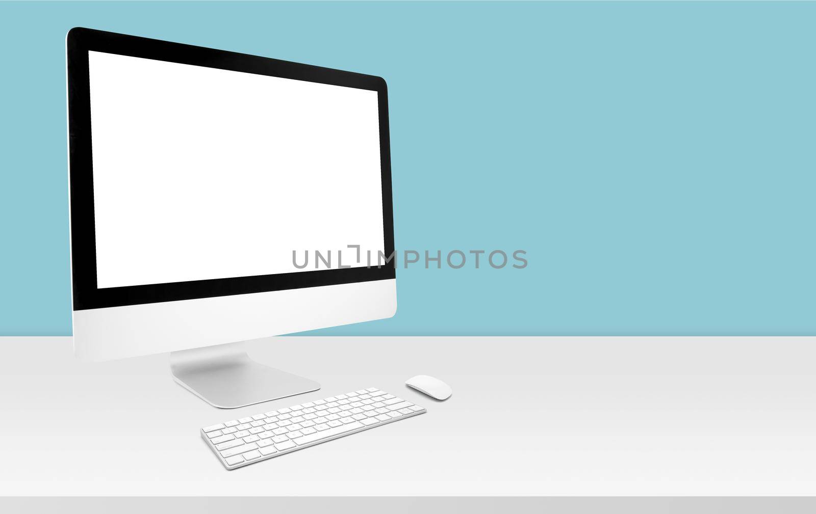 Mockup desktop computer display blank screen on desk in office, workspace with mock up computer screen empty and keyboard, mouse, copy space on table in home, business presentation concept. by nnudoo
