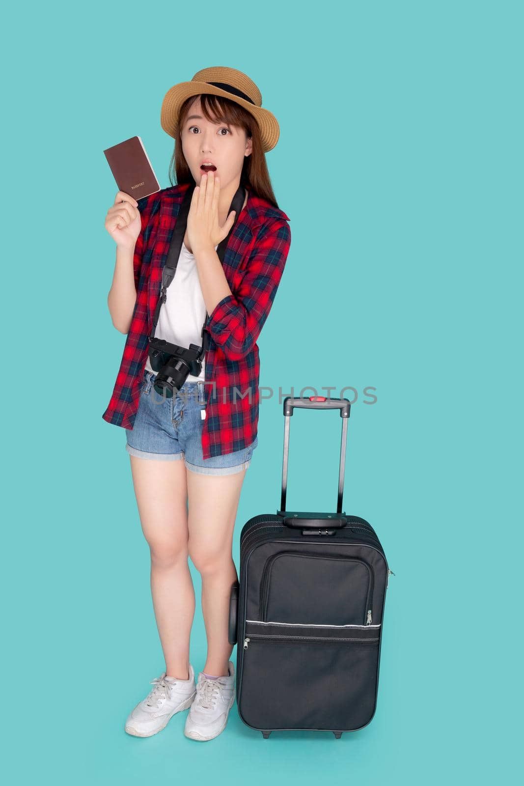 Beautiful young asian woman gesture surprise and travel summer trip with luggage and holding passport for abroad in vacation, asia girl shocked having camera with suitcase for journey in holiday. by nnudoo