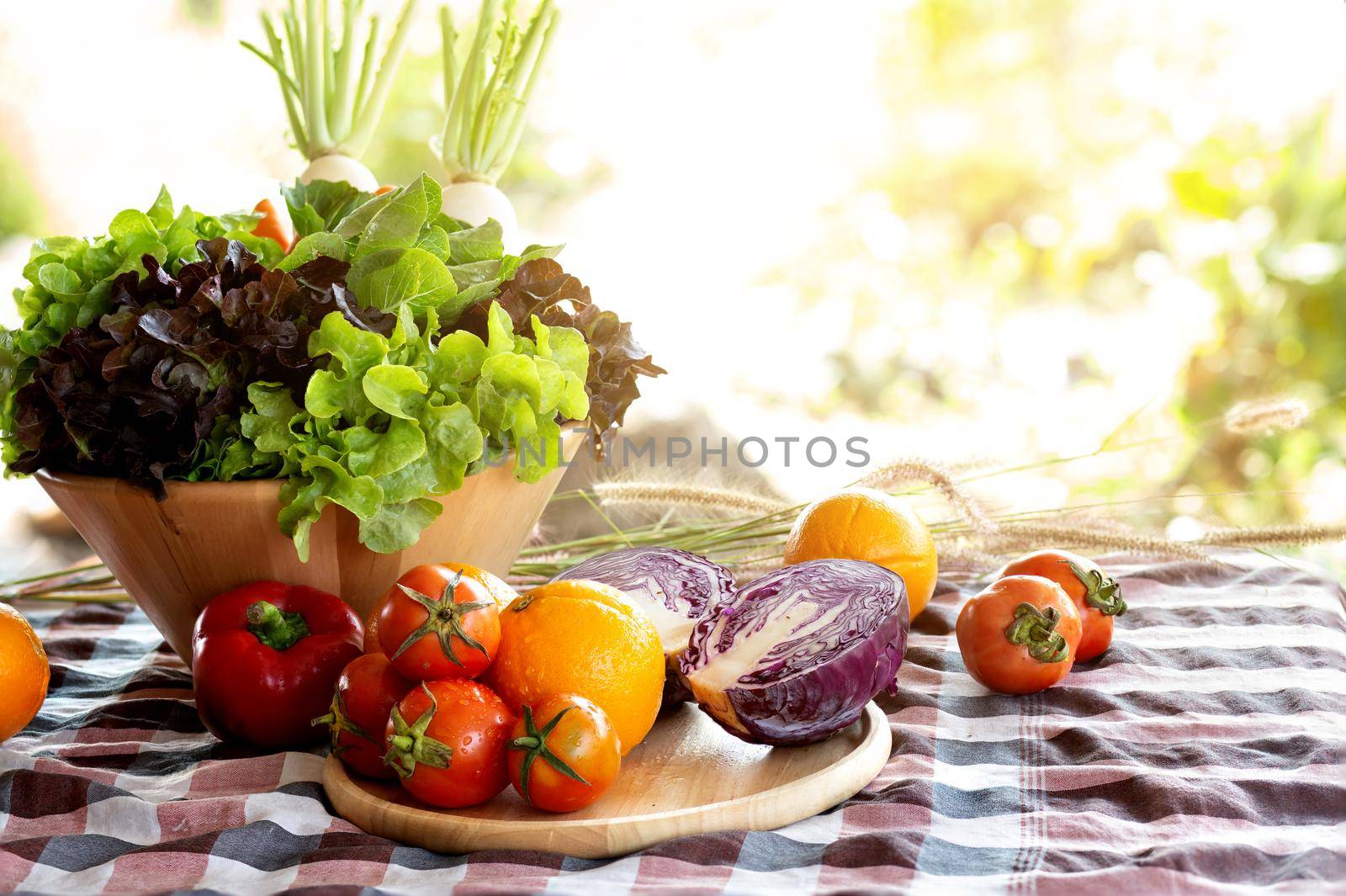 Fresh organic raw vegetable and fruit in bowl for salad on table, vegetarian and healthy food or ingredient and herb for cooking health with copy space, harvest for farm, nutrition concept.