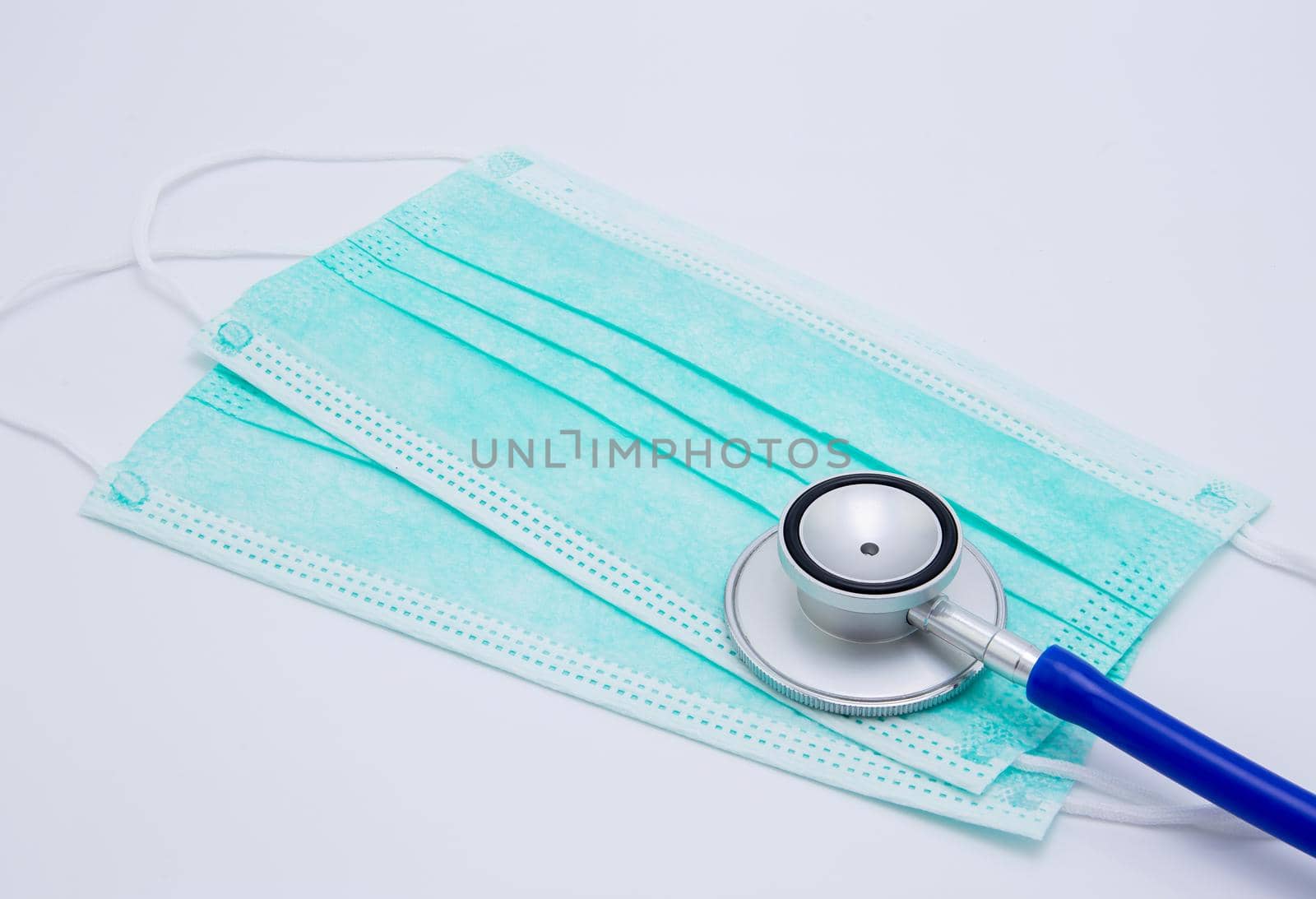 Face mask for protective epidemic covid-19 and stethoscope isolated on white background, equipment for protect outbreak of coronavirus, safety and hygiene, prevention for bacteria and allergy.