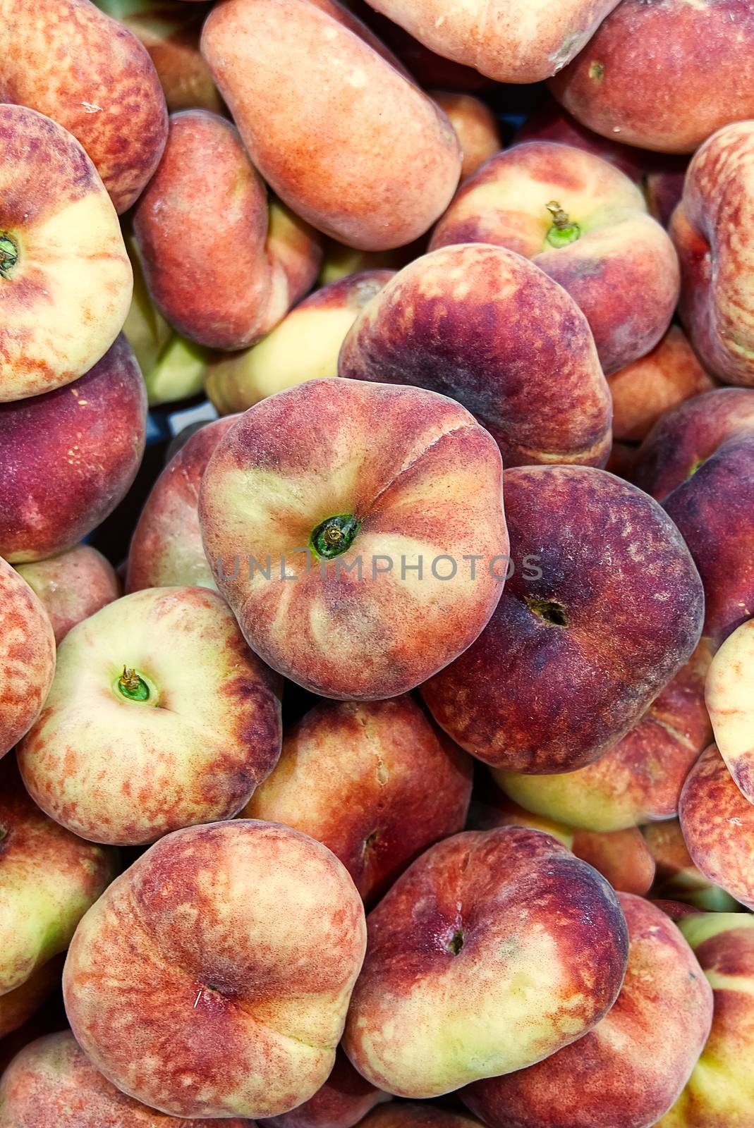 Fresh Organic Flat Peaches Heap Of Fresh Ripe Peaches At Market. by PhotoTime