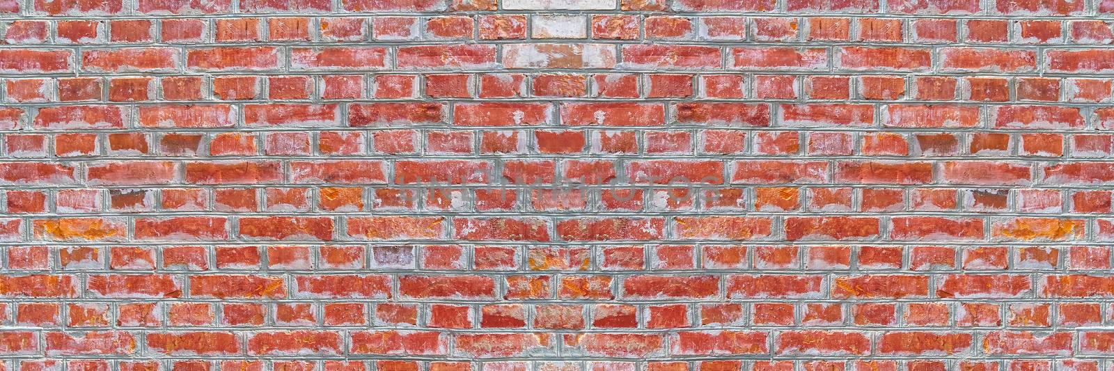Panoramic rugged old red brown bricks wall texture. vintage retro industrial banner background