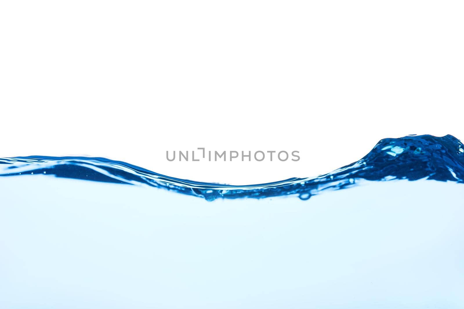 Light blue water wave with air bubbles and a little bit splashed underwater