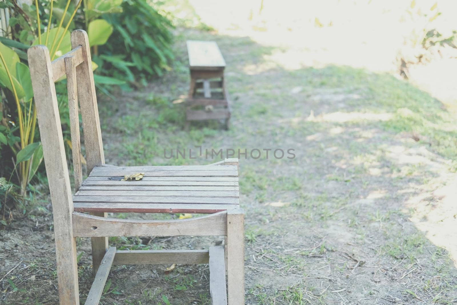 old wooden chair in garden