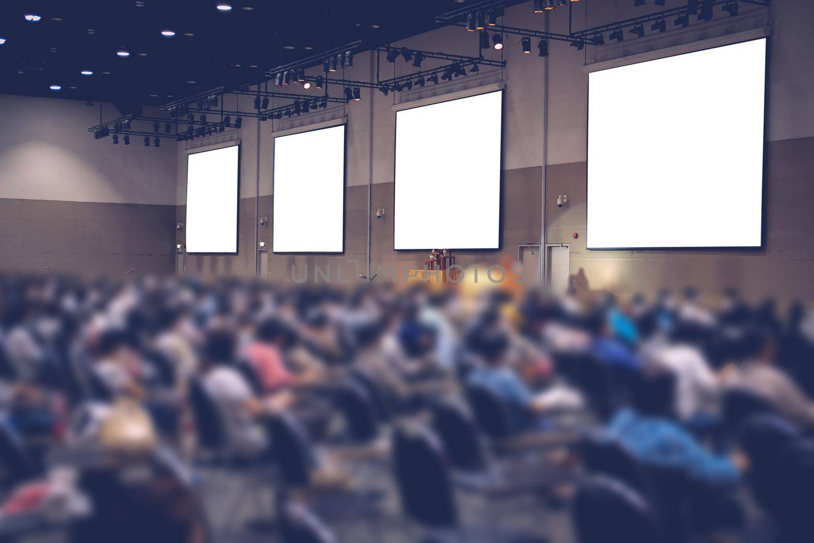 stage & presentation screen in seminar conference room. blurry background