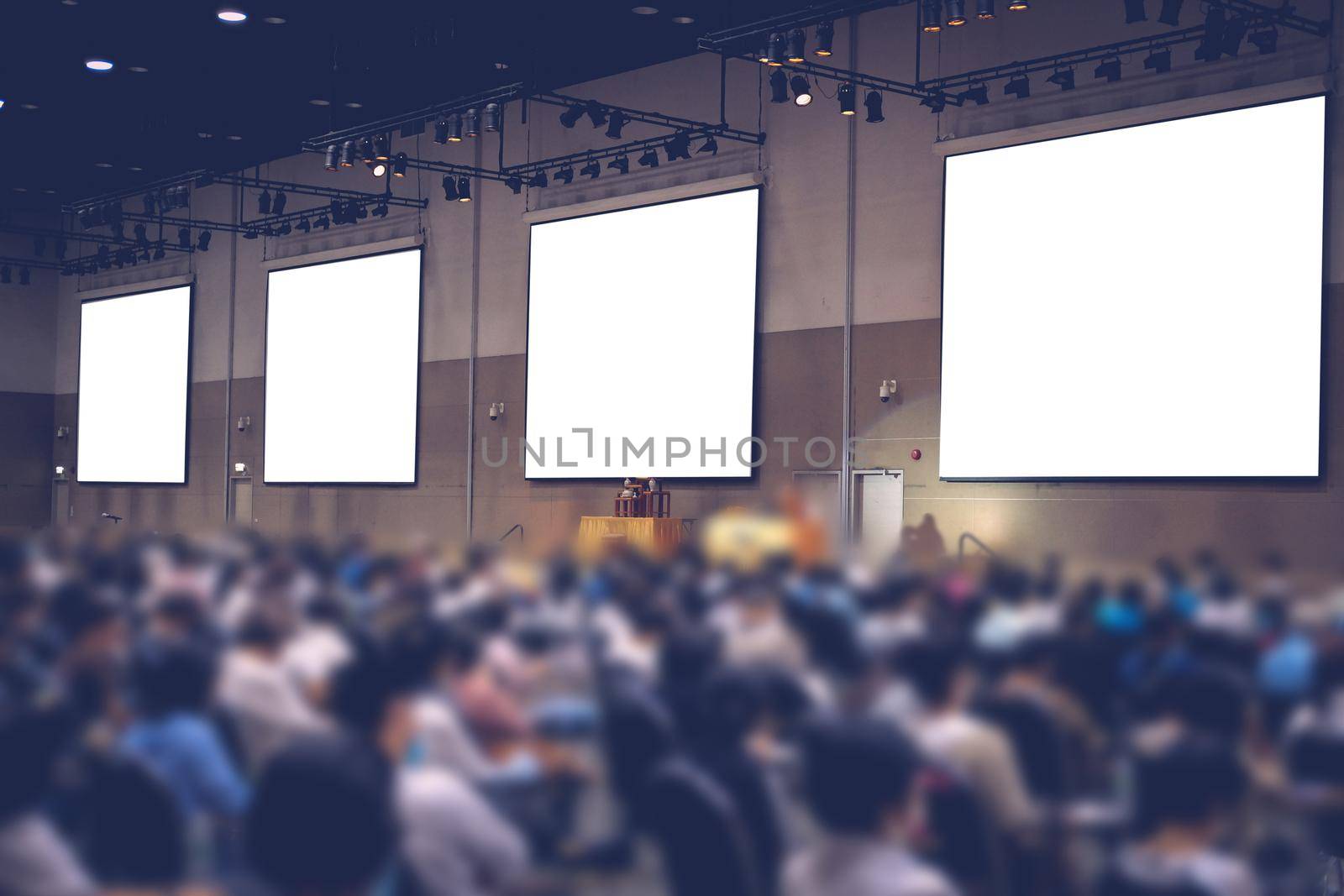 stage & presentation screen in seminar conference room. blurry background