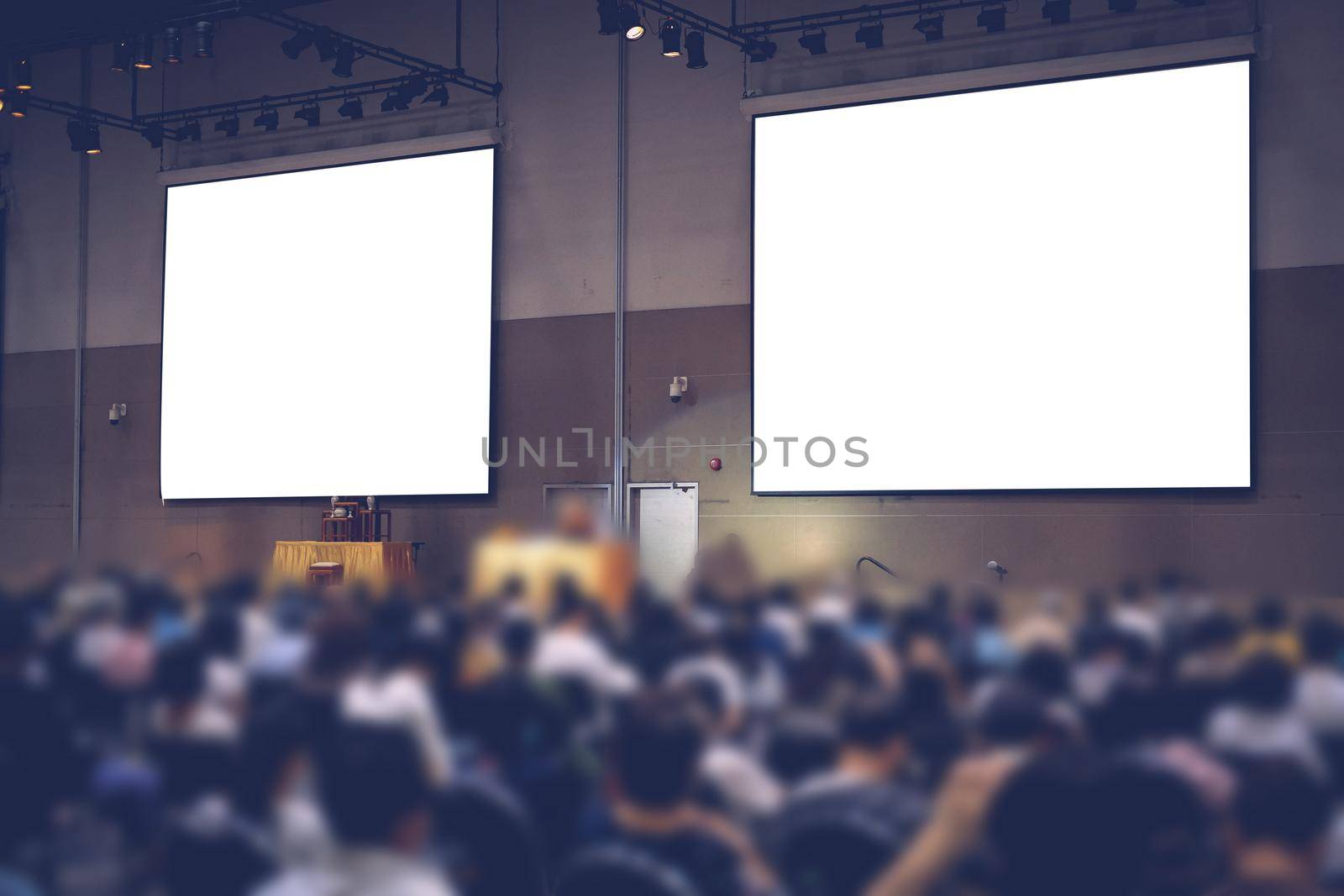 stage & presentation screen in seminar conference room. blurry background