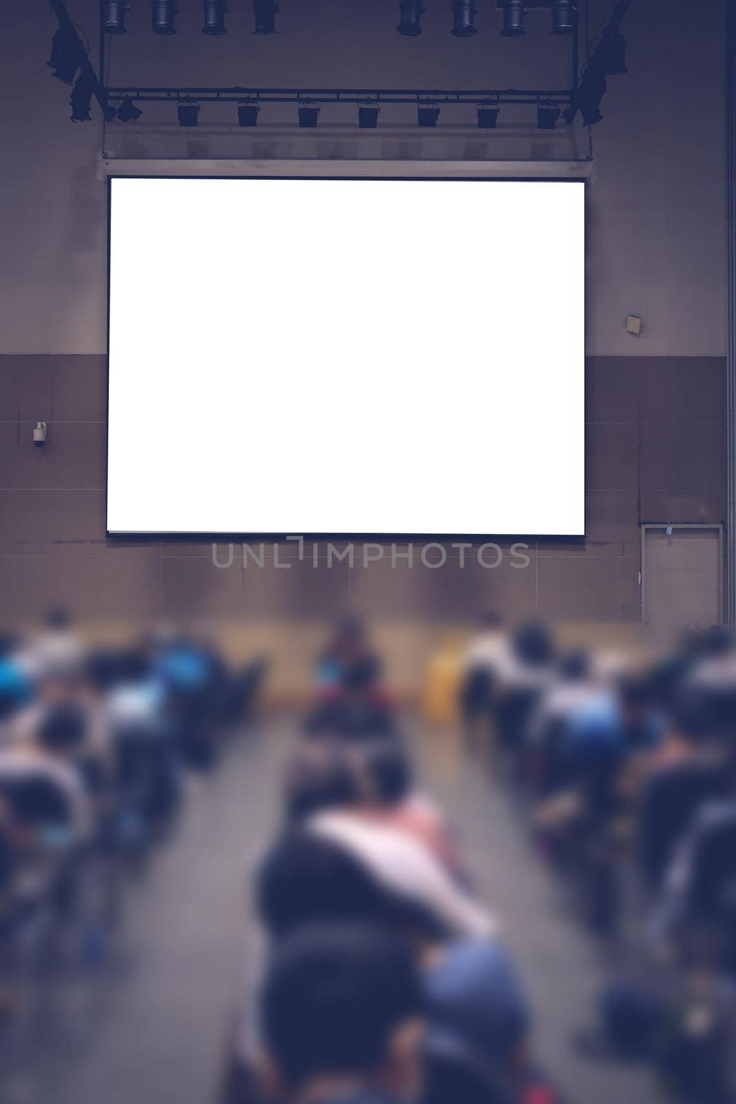 stage & presentation screen in seminar conference room. blurry background