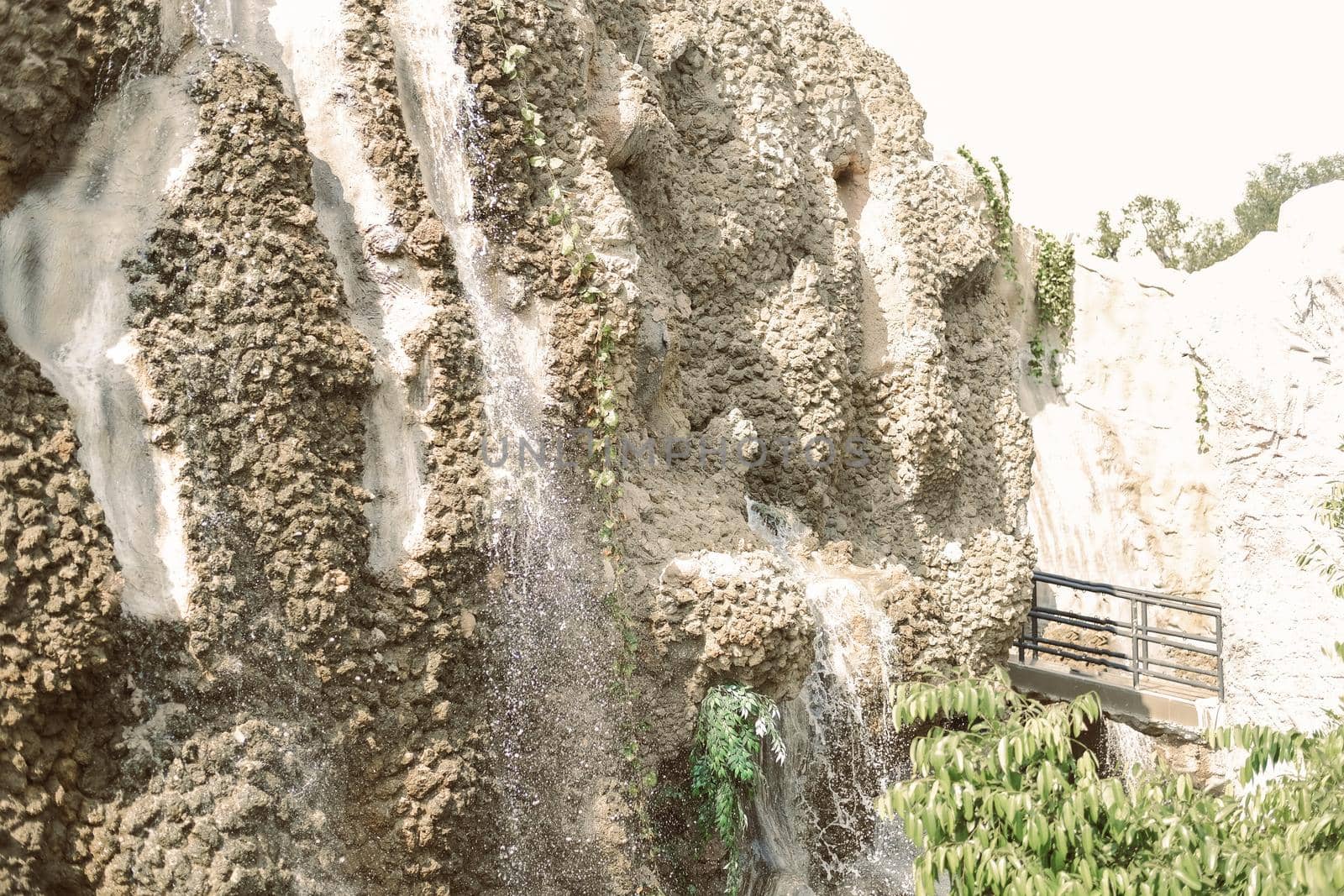 manmade waterfall park. flowing water stream