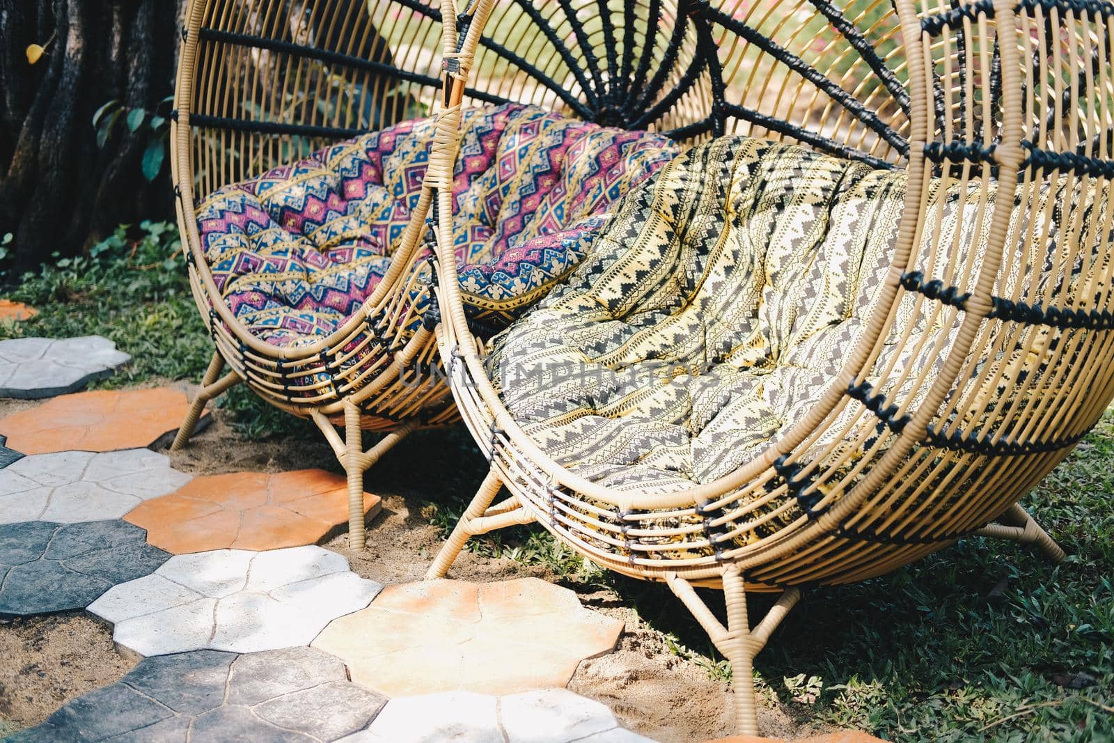 cushion on wicker rattan chair in garden