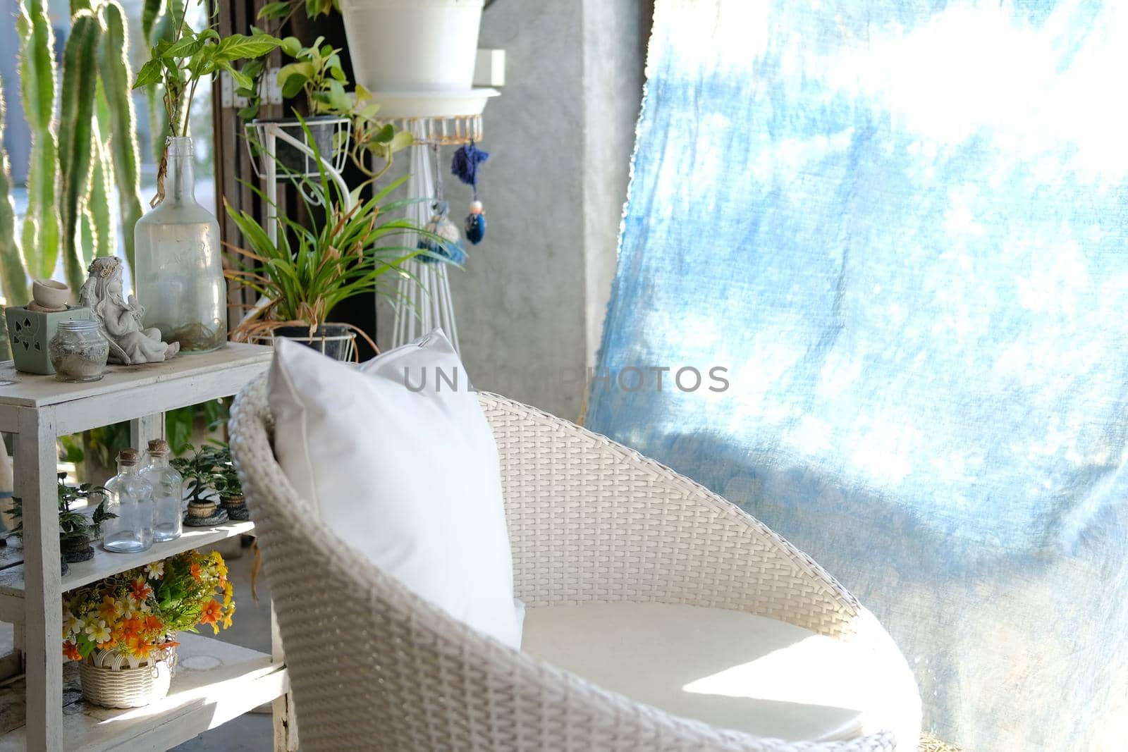 white wicker rattan chair sofa on patio at home
