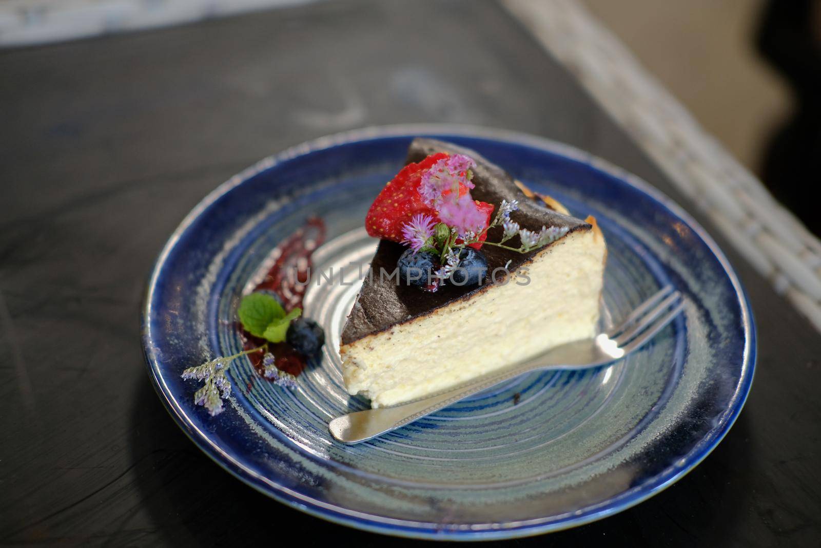 keto vegan flourless cheesecake decorating with flower. ketogenic low carb and gluten-free diet