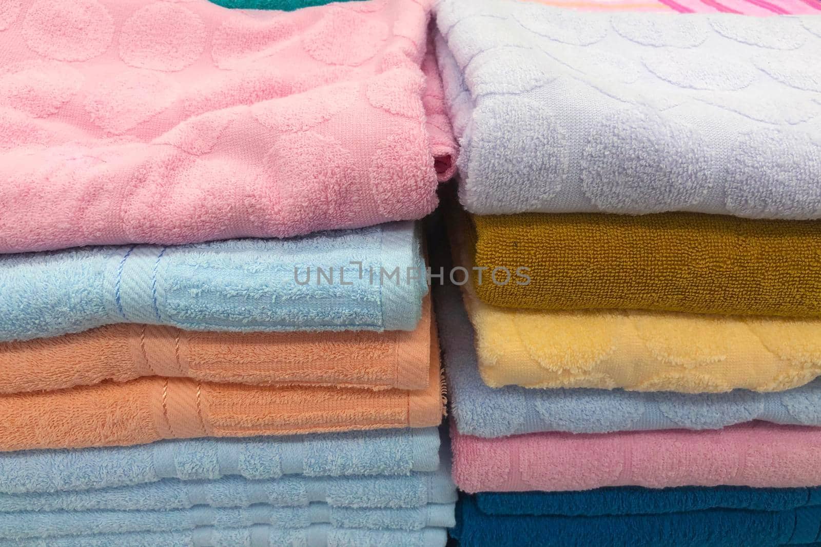 Folded towels for sale in the mall. by iPixel_Studio