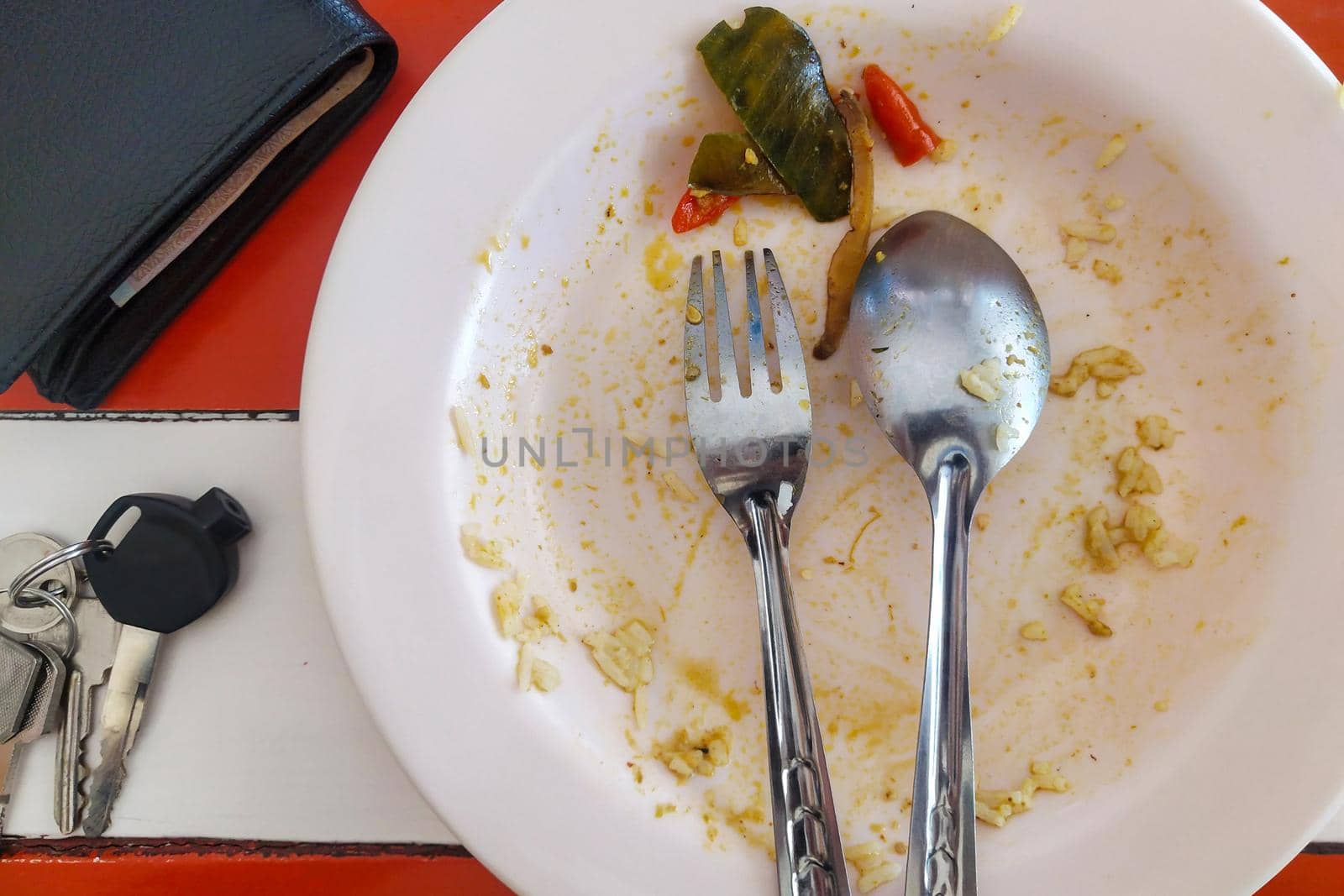 Rice plate after eating out, placed on the table