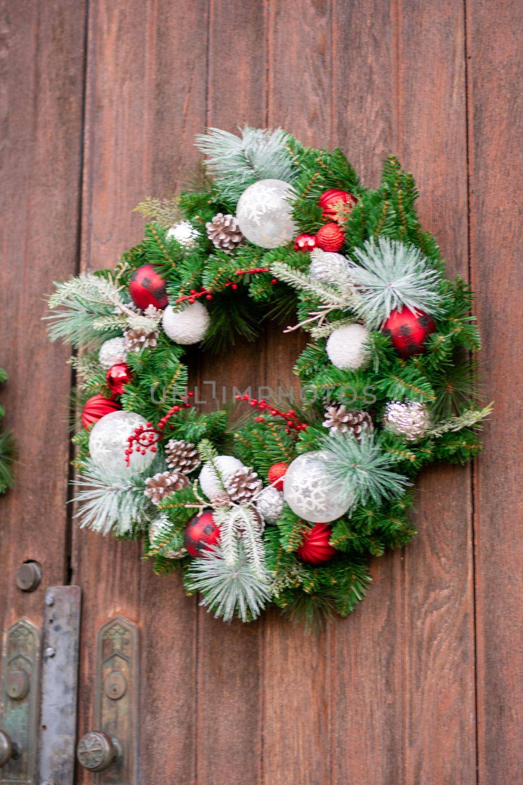 A Christmas Wreath on a Wooden Door by bju12290