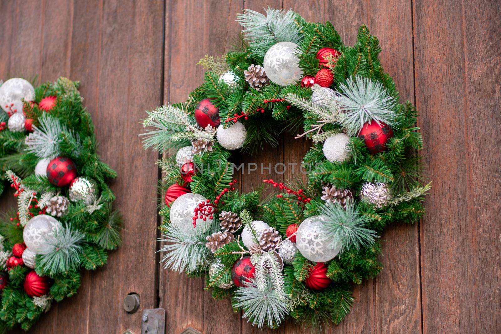 A Christmas Wreath on a Wooden Door by bju12290