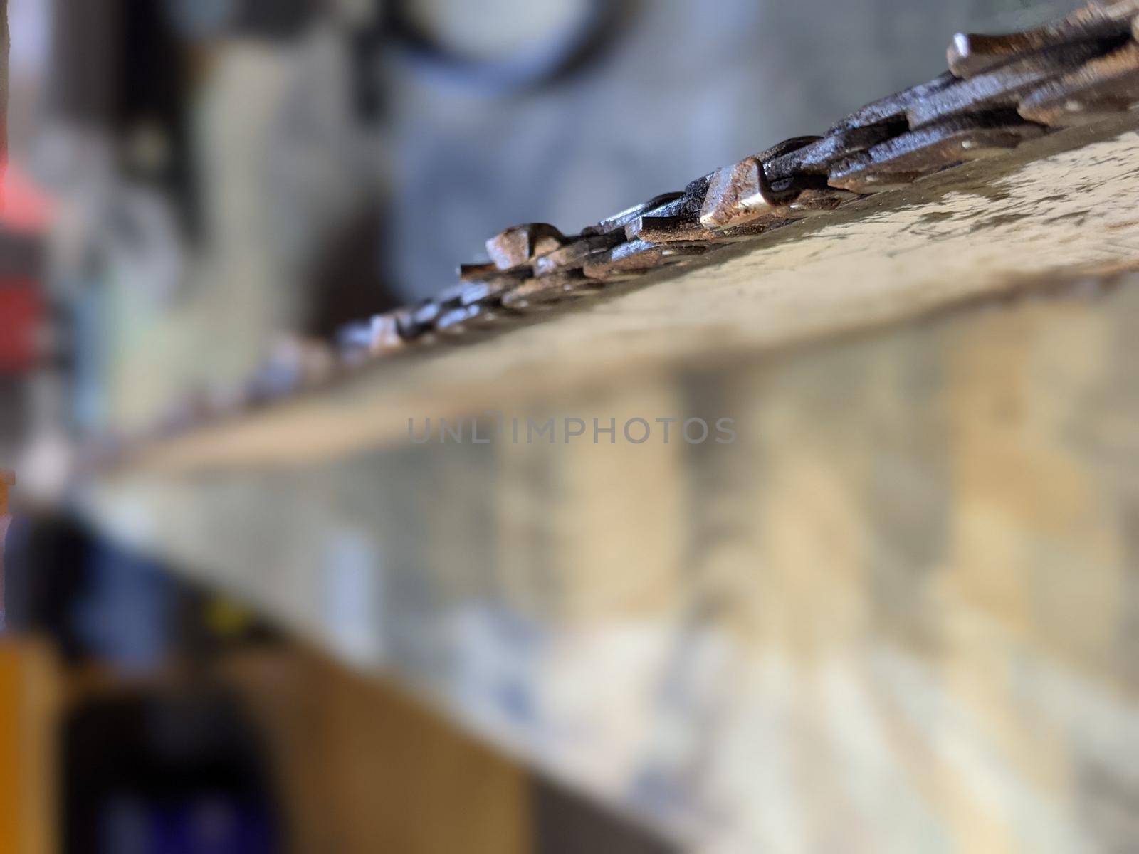 chainsaw chain shapening on shop table