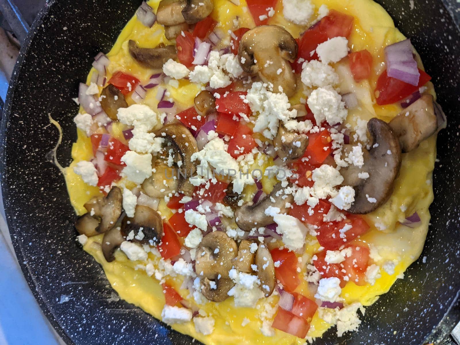 yummy Omelet Cooking in Frypan Top View by digidreamgrafix