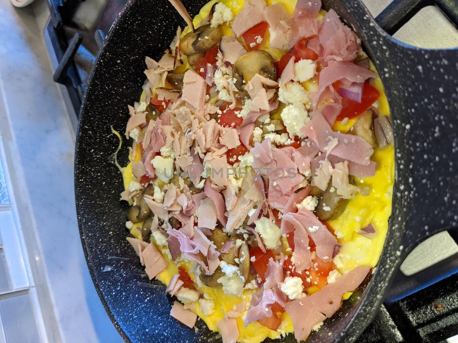 yummy Omelet Cooking in Frypan Top View by digidreamgrafix