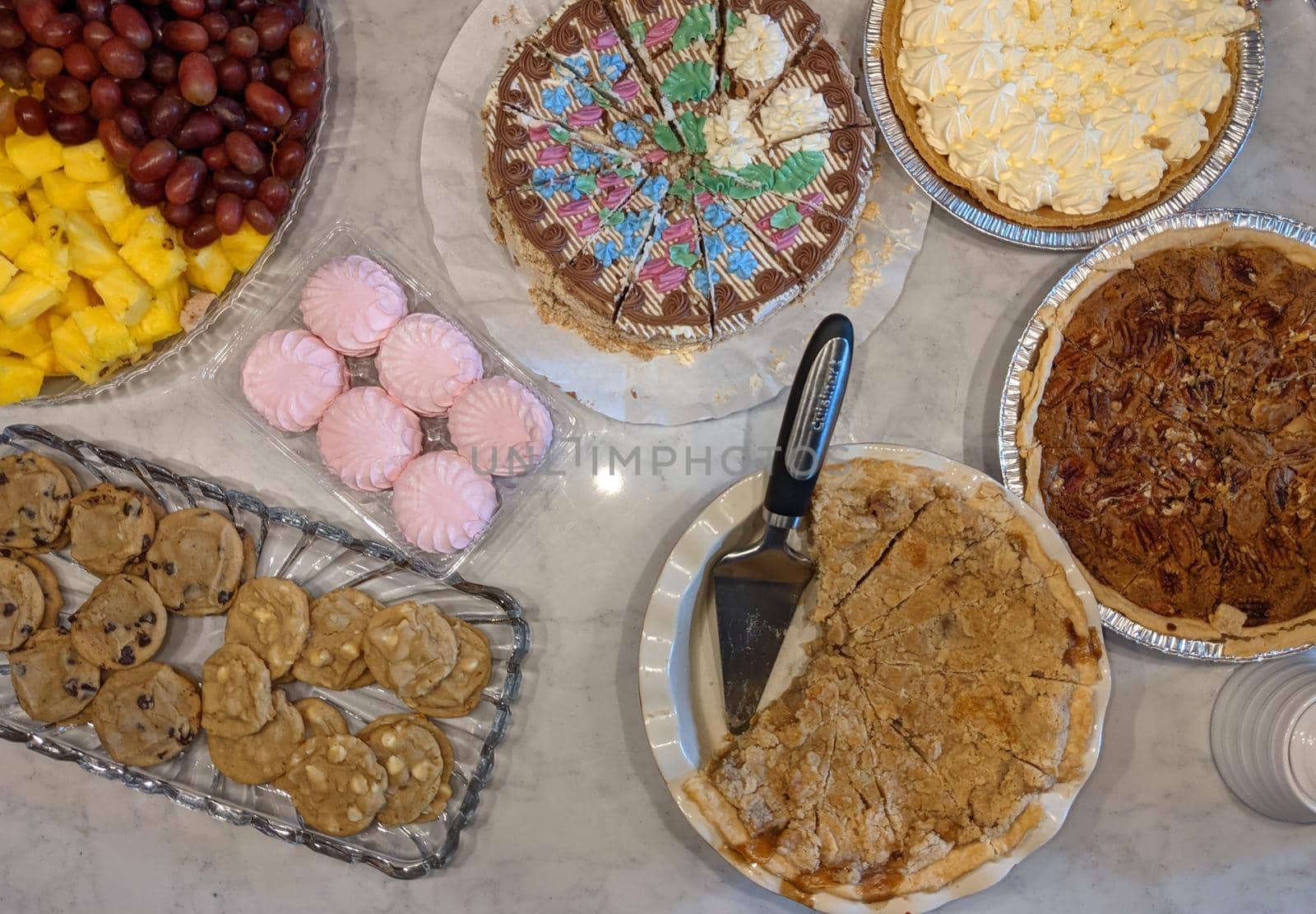 variety of cakes and desserts on table for holidays by digidreamgrafix