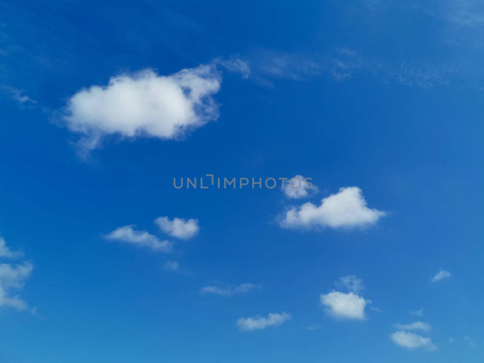 Beautiful shot of a blue sky with fluffy soft clouds