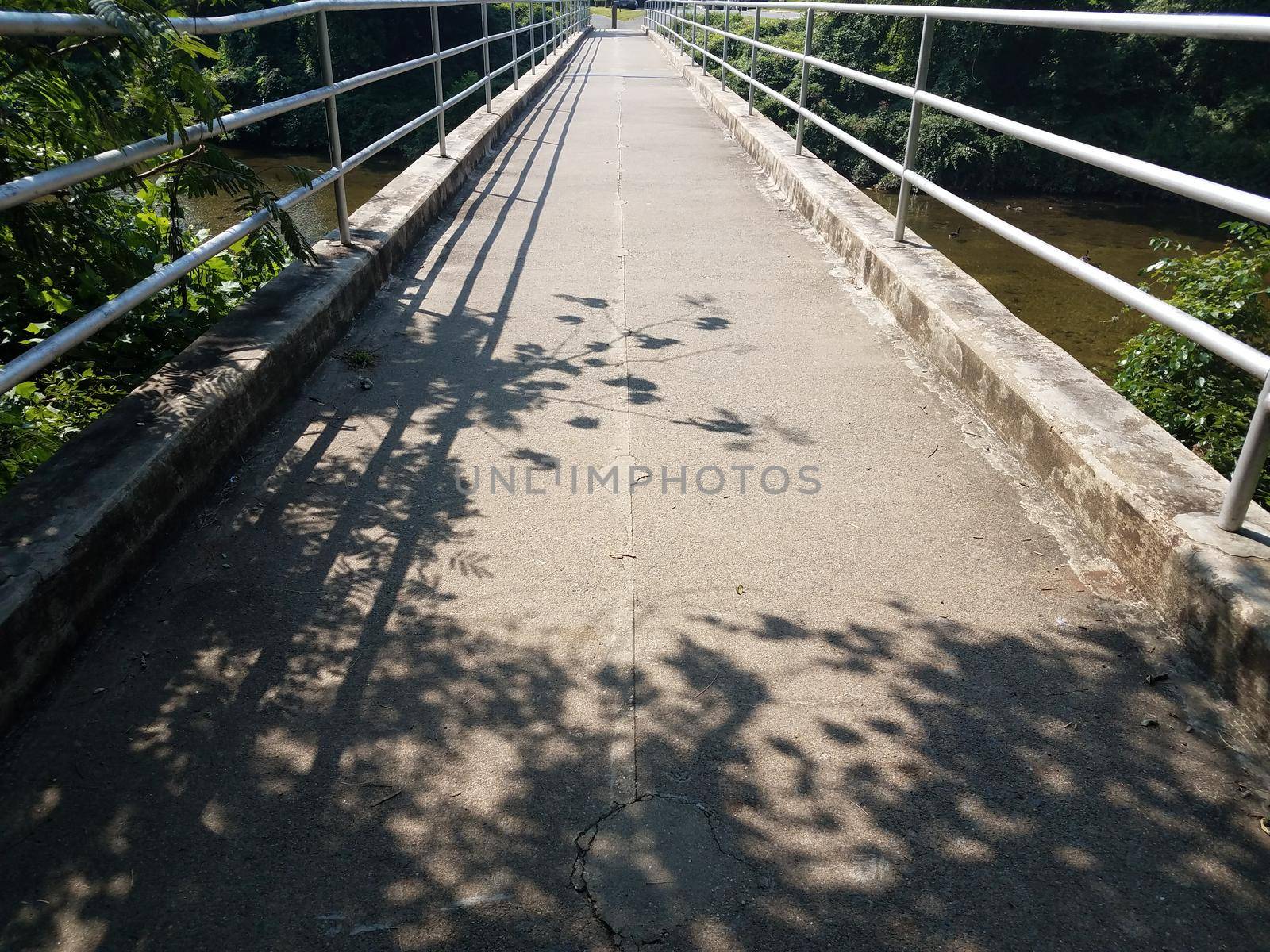 trail on a bridge with metal hand rails