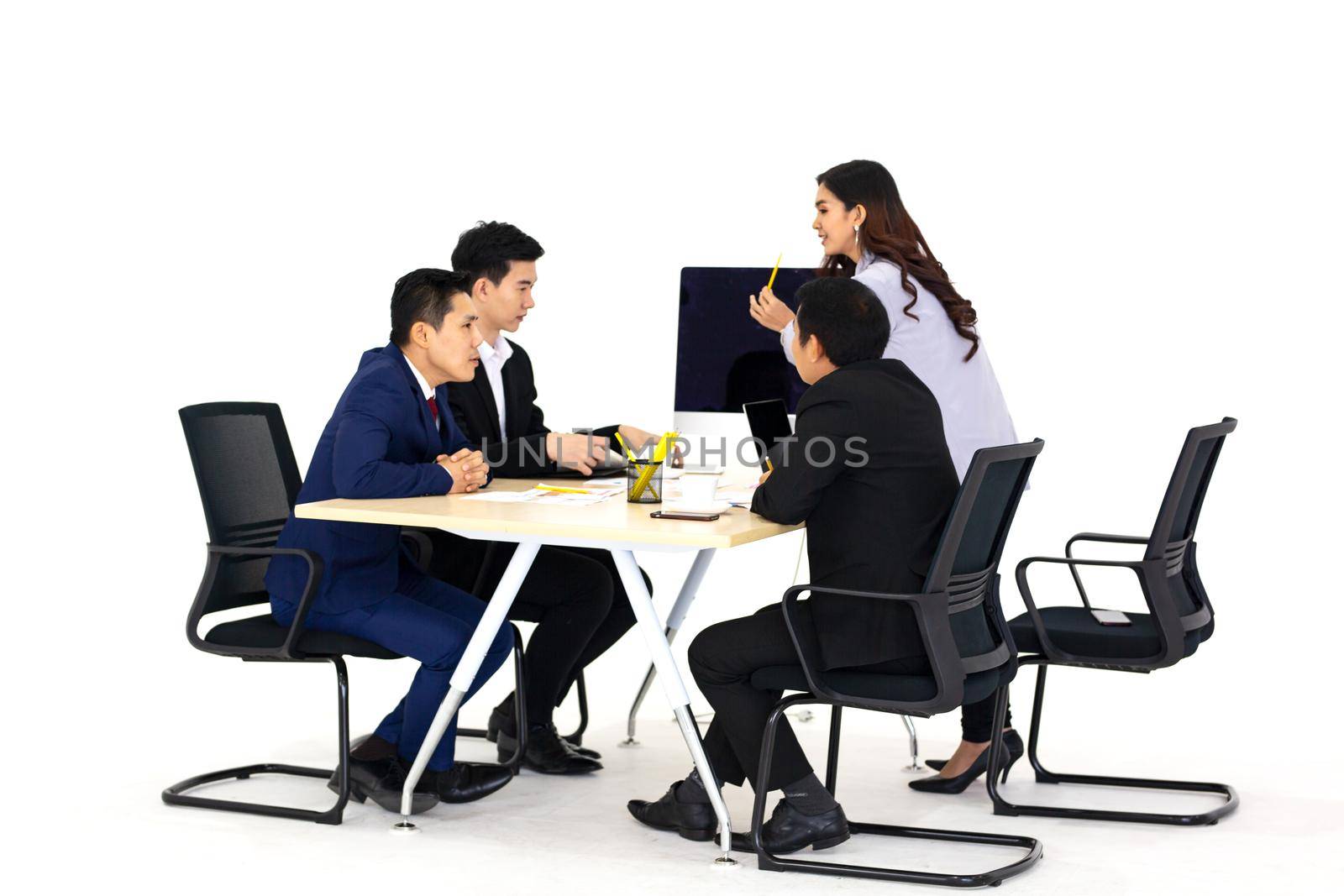 Young business team discussing and studying statistics in a meeting room by chuanchai
