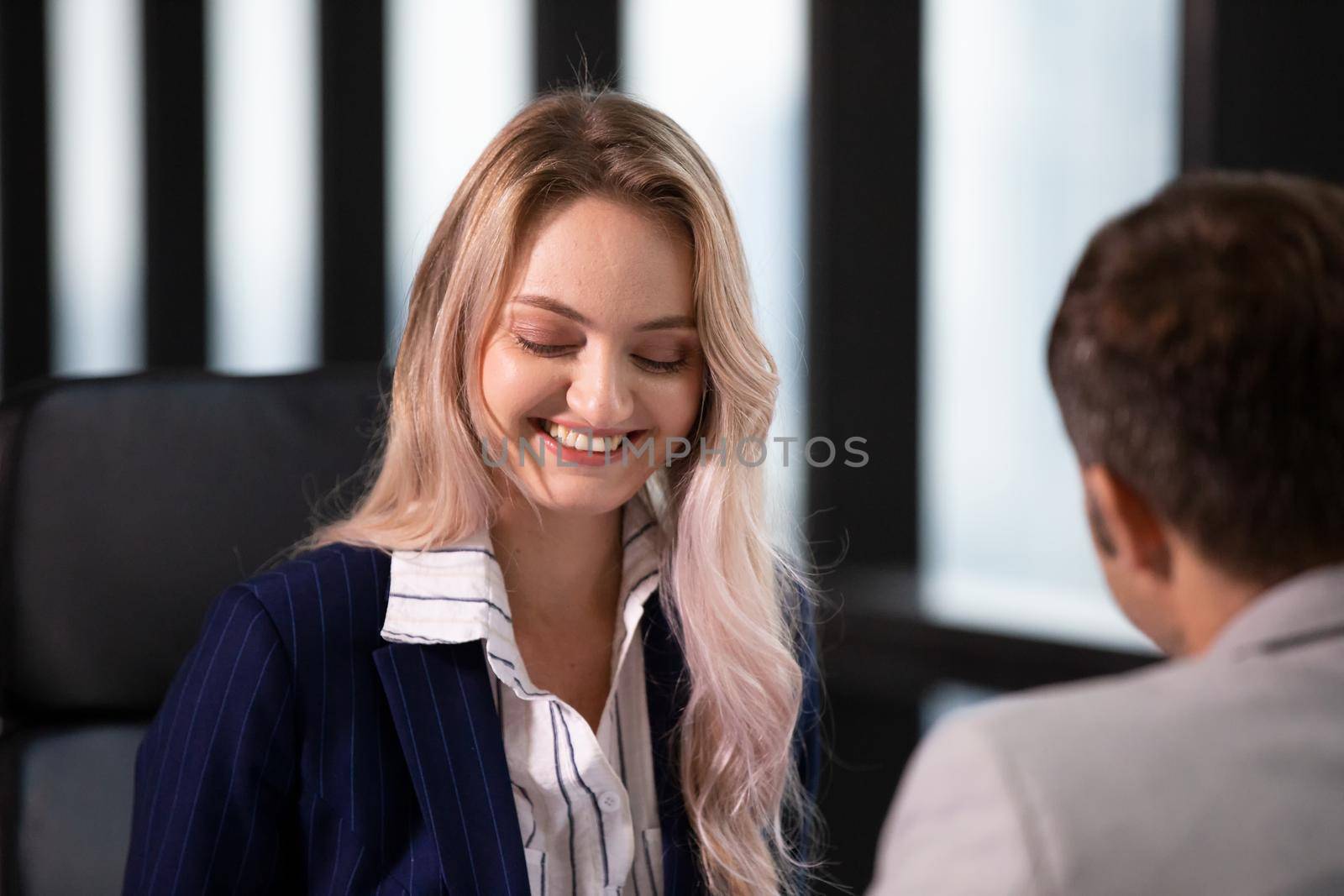 Business women discussing coworker