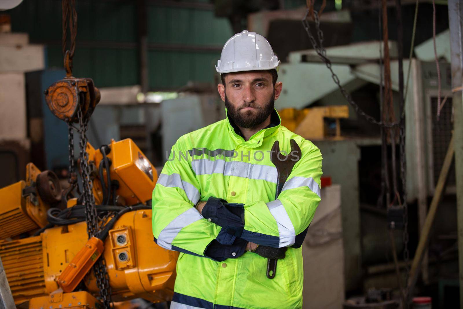 Portrait of male Engineer standing with confident against machine environment in factory, Engineers operating a machine in factory by chuanchai