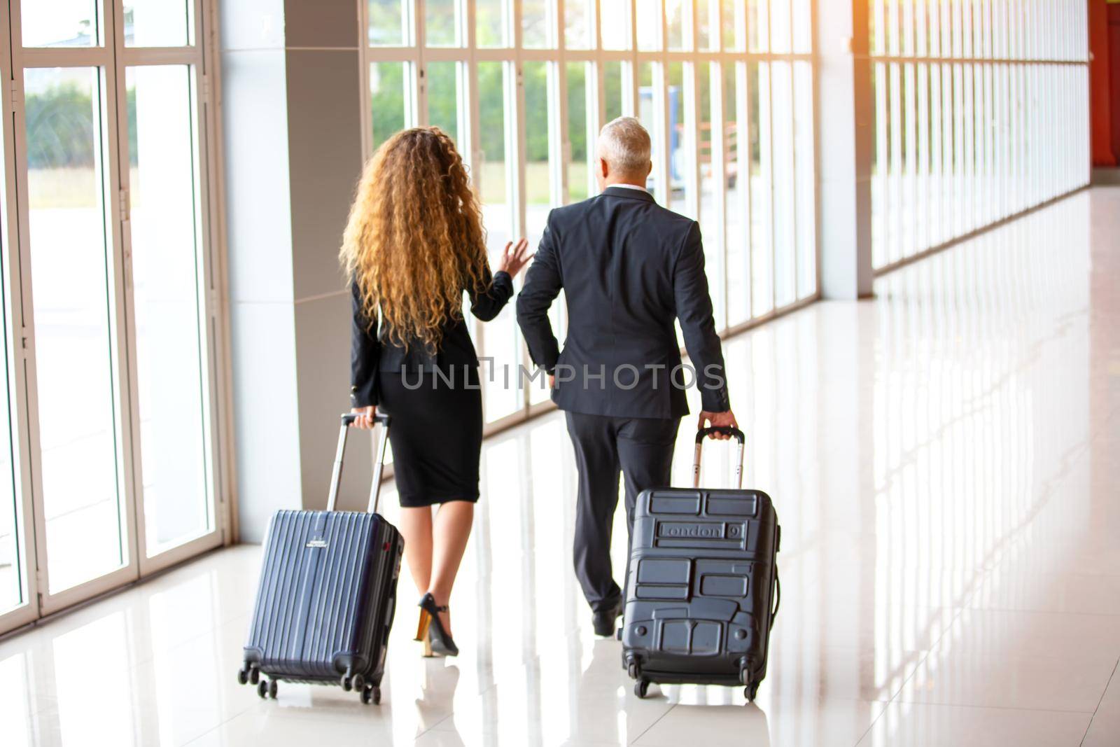 Business people on travel at Airport, Business man at international airport moving to terminal gate for airplane travel trip - Mobility concept and aerospace industry flight connections