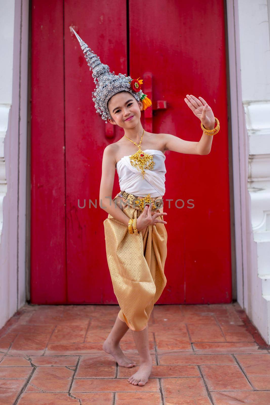 Thai traditional dress. Young kid Actors performs Thai ancient dancing Art of Thai classical dance in Thailand by chuanchai