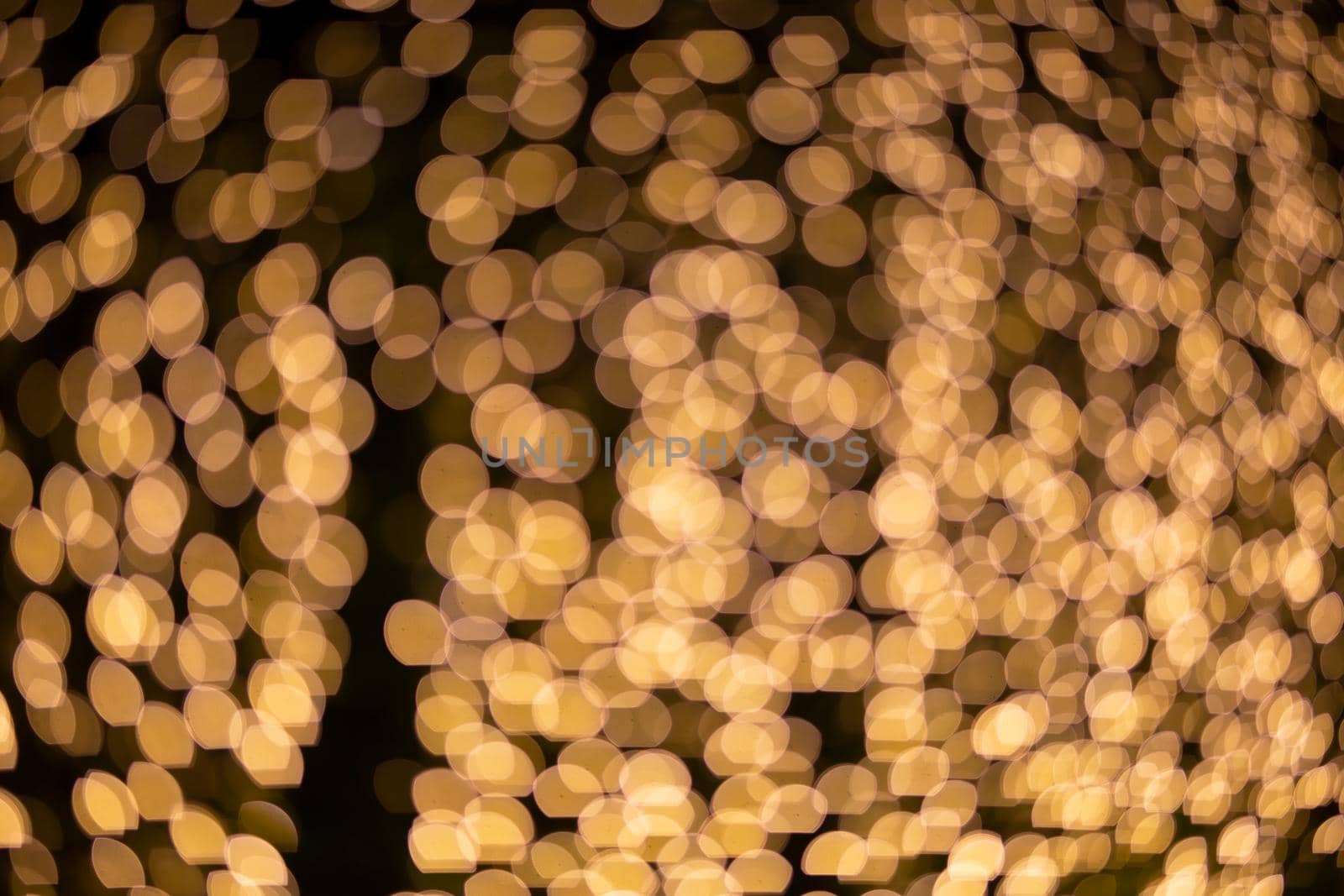 Abstract blurred Christmas light bokeh background. by chuanchai