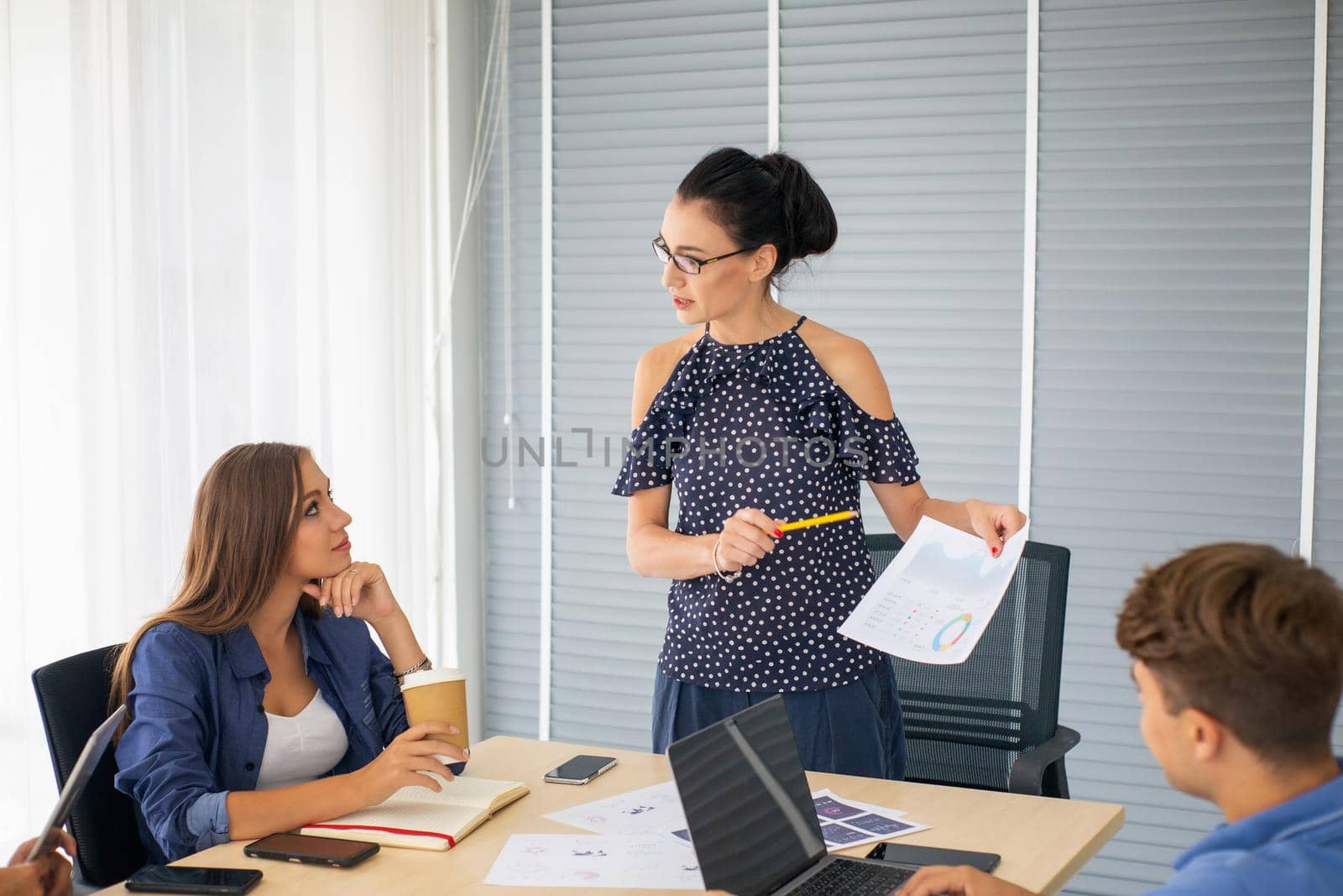 Business people working in office on desktop computer, Group of happy business people in smart casual wear looking at the laptop and gesturing. Achieving success. by chuanchai