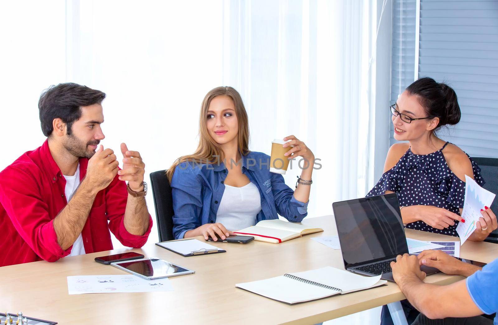 Business people working in office on desktop computer, Group of happy business people in smart casual wear looking at the laptop and gesturing. Achieving success. by chuanchai