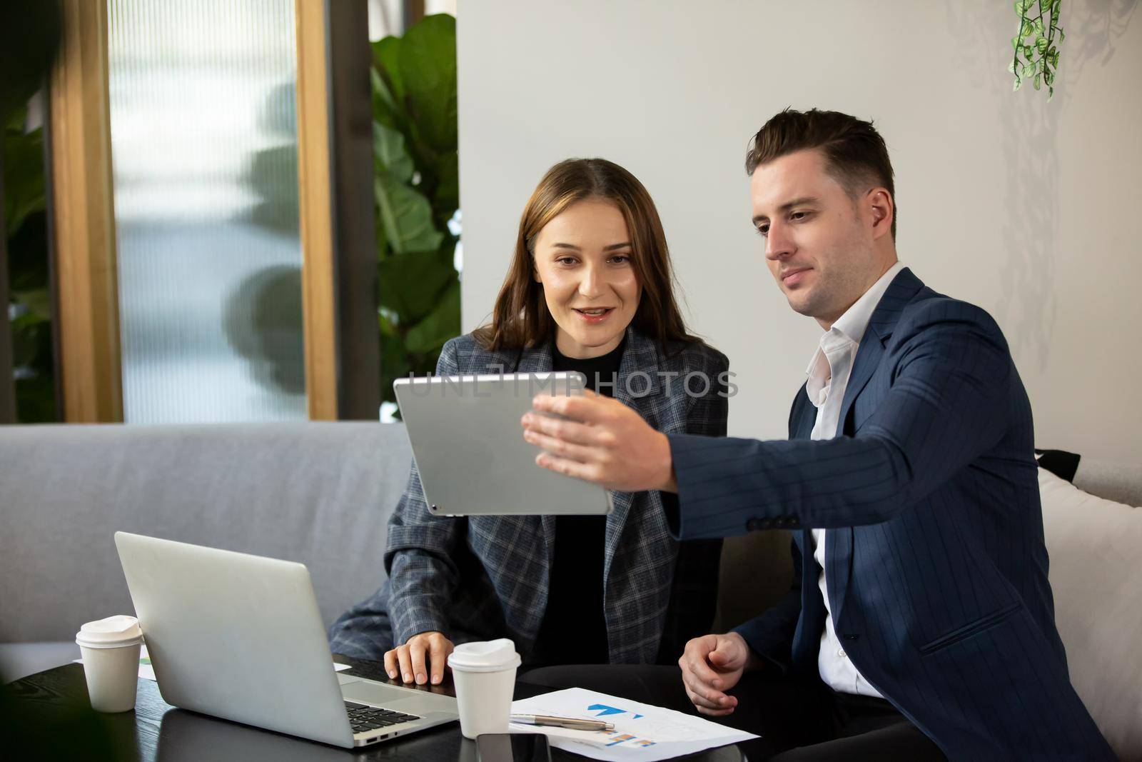 Business people in the modern office by chuanchai