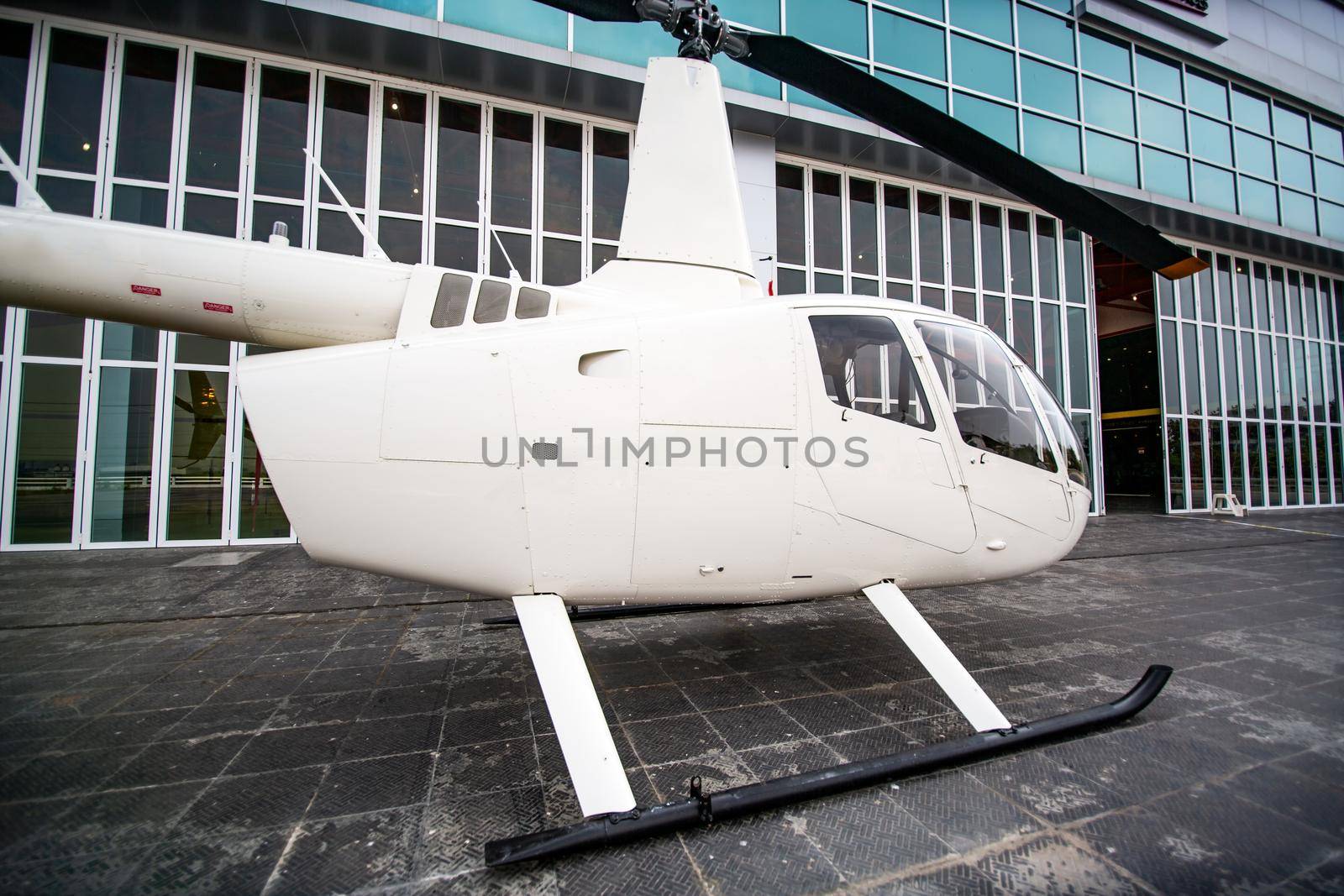 private commercial Helicopter parking by airport terminal