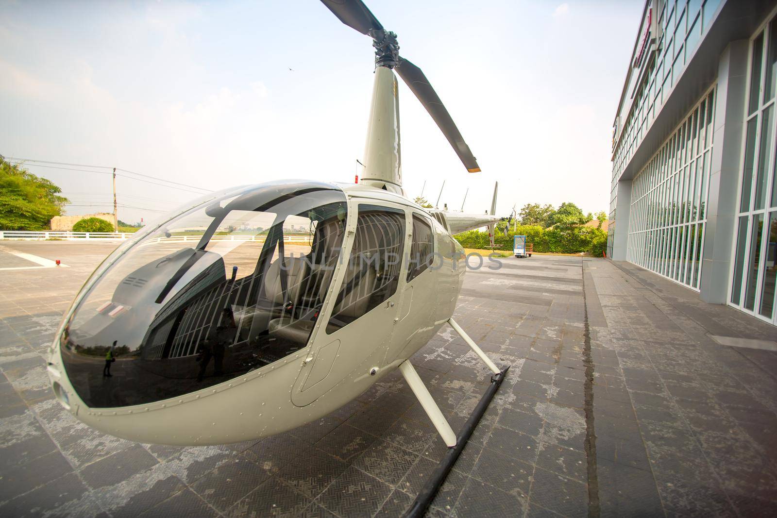 private commercial Helicopter parking by airport terminal