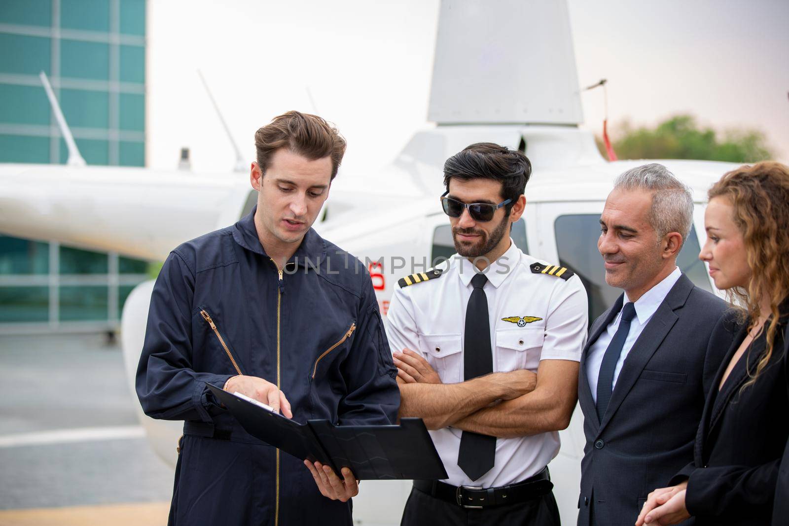 Technician report check of helicopter to pilot and helicopter service business owner