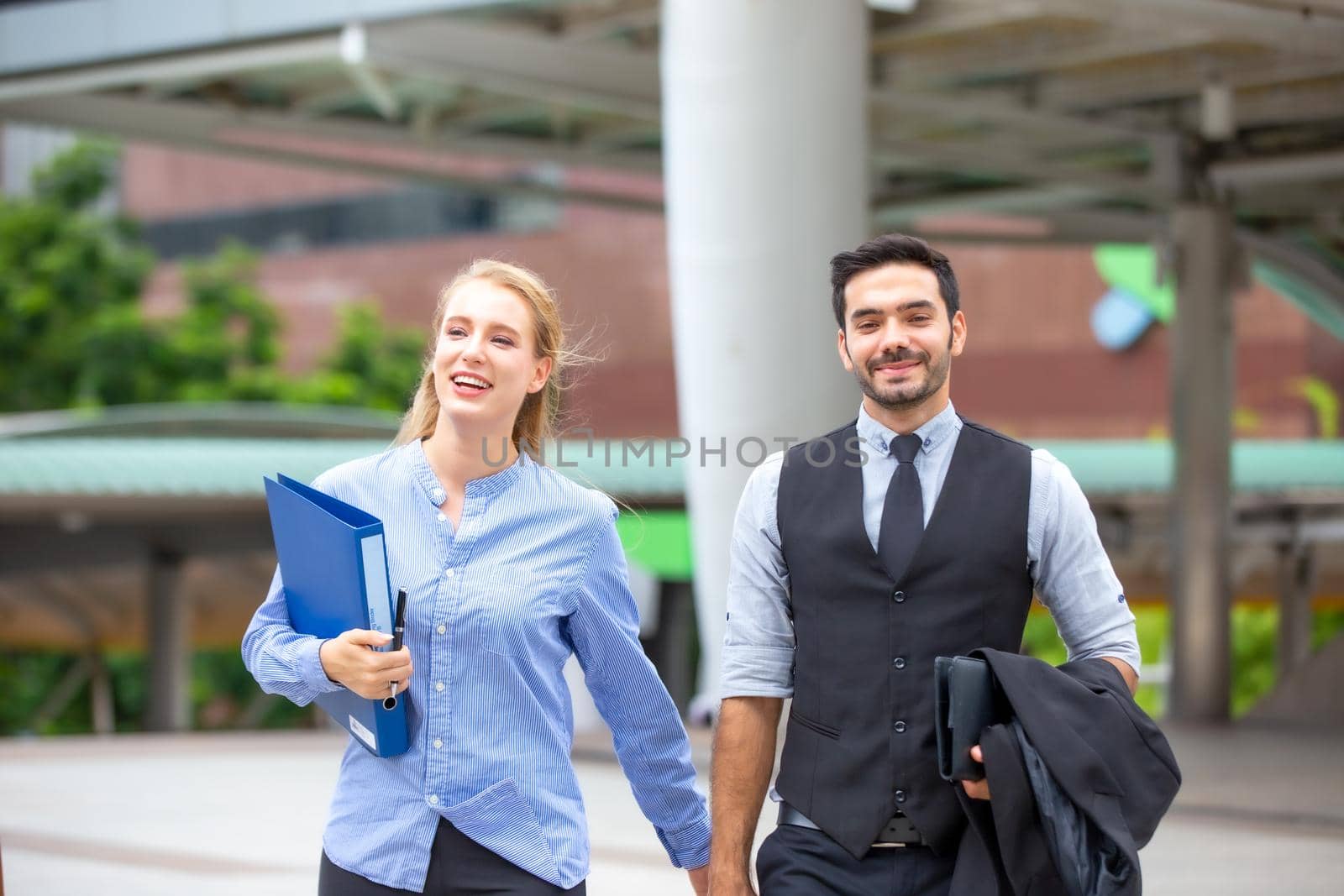 Business People Walking Handshake Professional Urban City Concept., Business people working in office on desktop computer, Group of happy business people in smart casual wear looking at the laptop and gesturing. Achieving success.