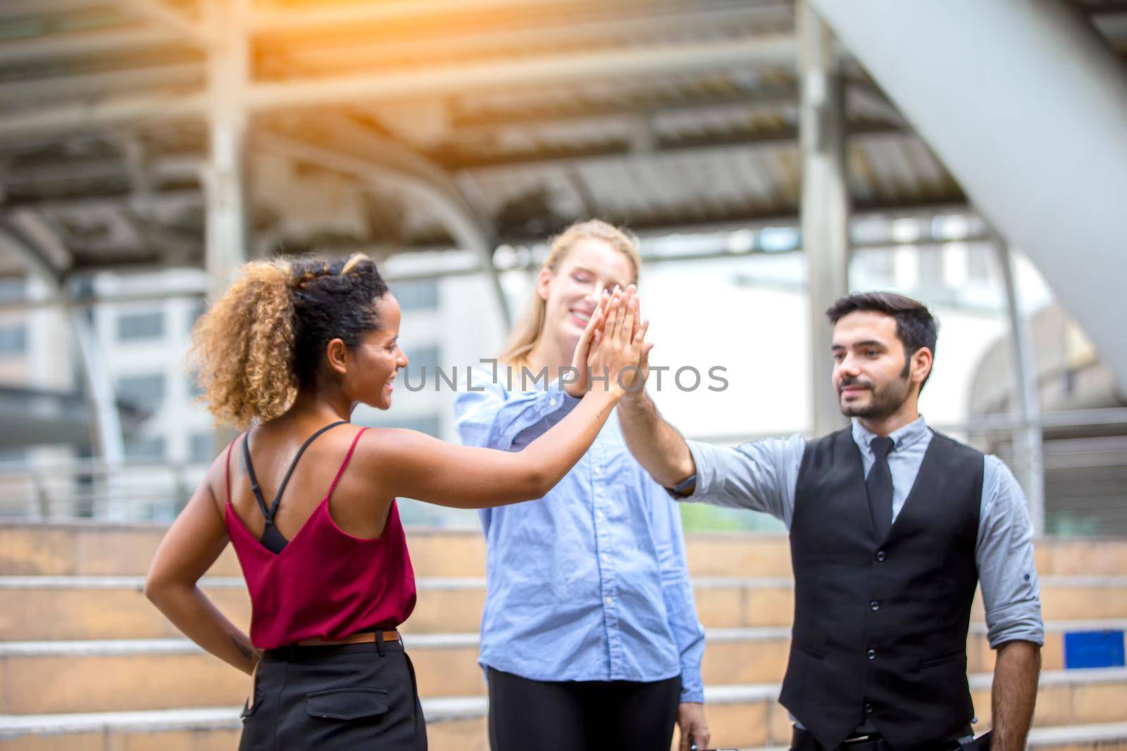 Business people working in office on desktop computer, Group of happy business people in smart casual wear looking at the laptop and gesturing. Achieving success. by chuanchai