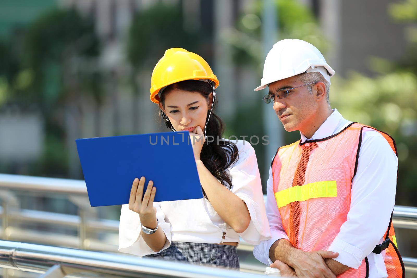 Engineering civil, Construction engineers discussion with architects at construction site or building site of high-rise building with Surveying for making contour plans by chuanchai