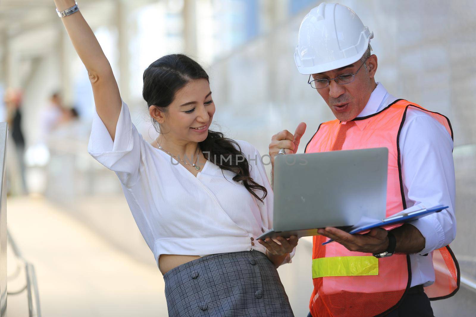 Construction engineers discussion with architects at construction site or building site
